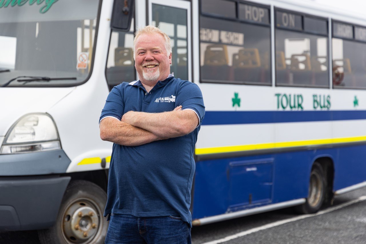 Tour Guide on the front of the Hop On Hop Off Tour Bus on Inis Mór - Aran Islands
